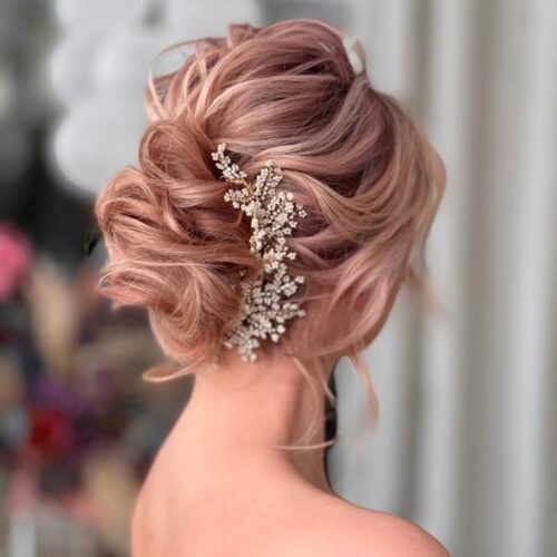 Airy-Texture-Updo woman with light pink hair done in an up-do by expert in Hair and Makeup Tauranga